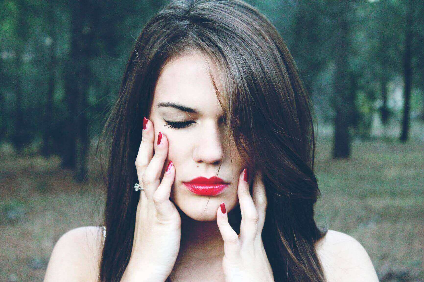 Girl With Tooth Pain Holding Her Jaw