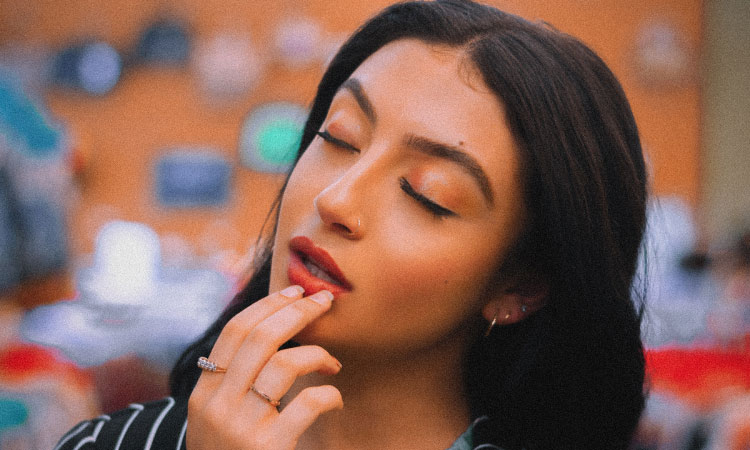 woman touching her lower lip contemplating gum disease