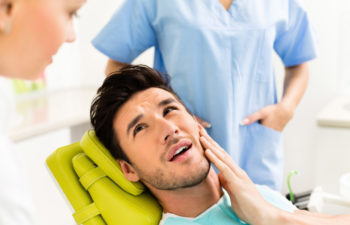 man in the dentist's chair getting a cavity treated