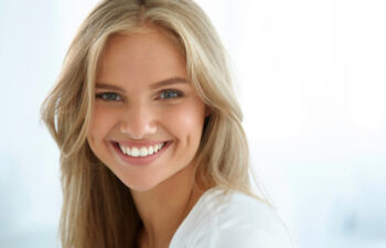 young woman with a big smile from Invisalign